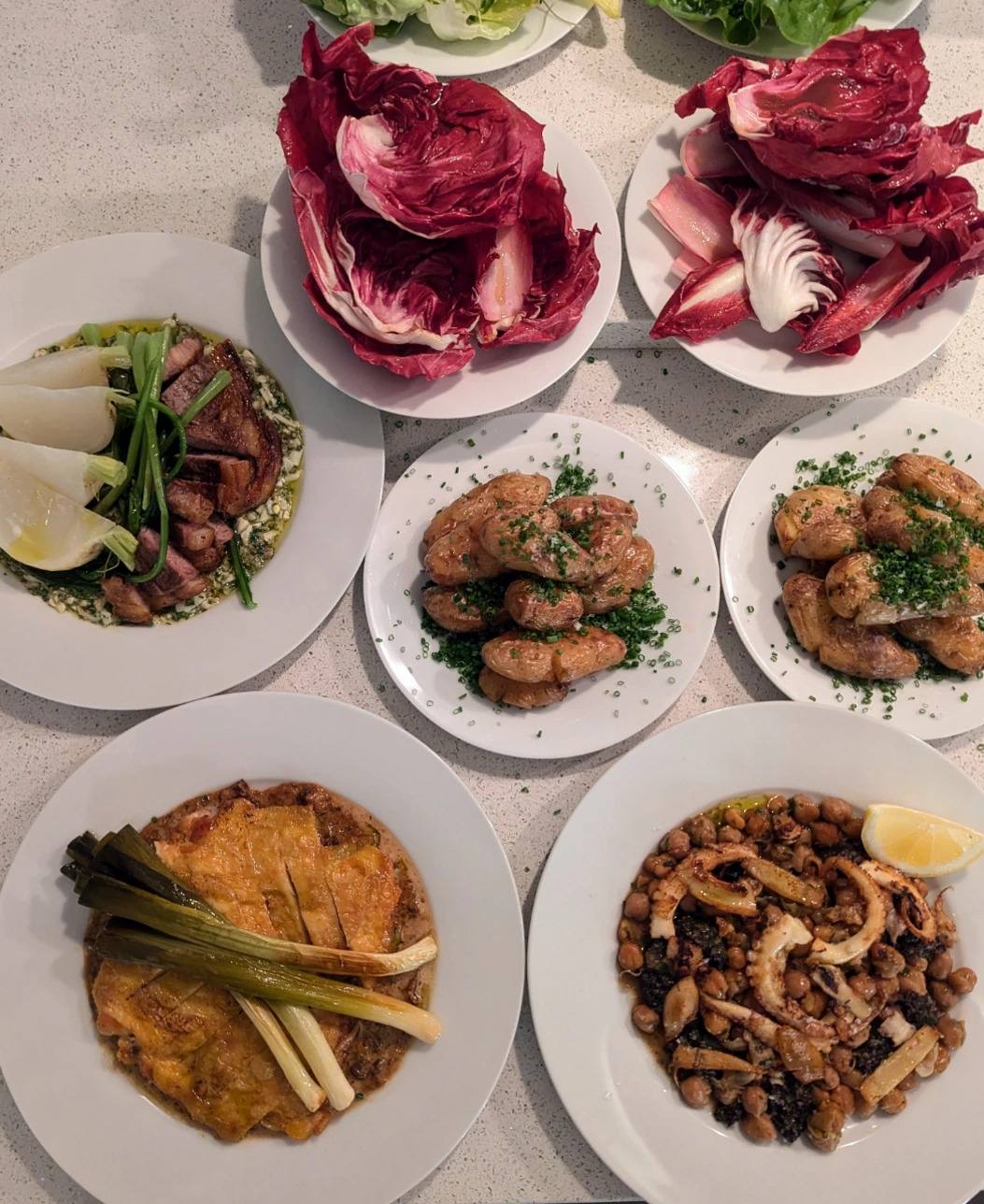 A table spread of shared plates.